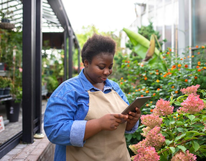 black-woman-running-flower-business-side-view